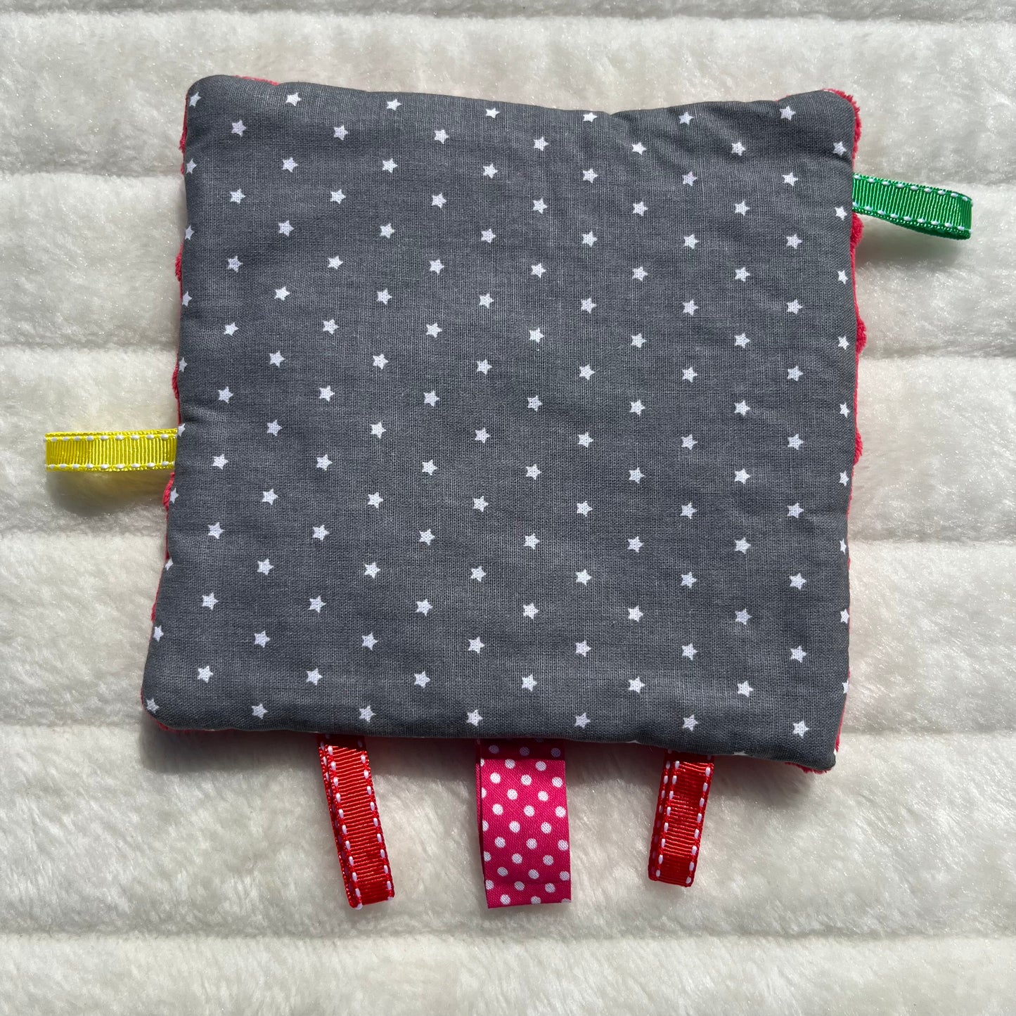 Doudou plat gris à pois blanc